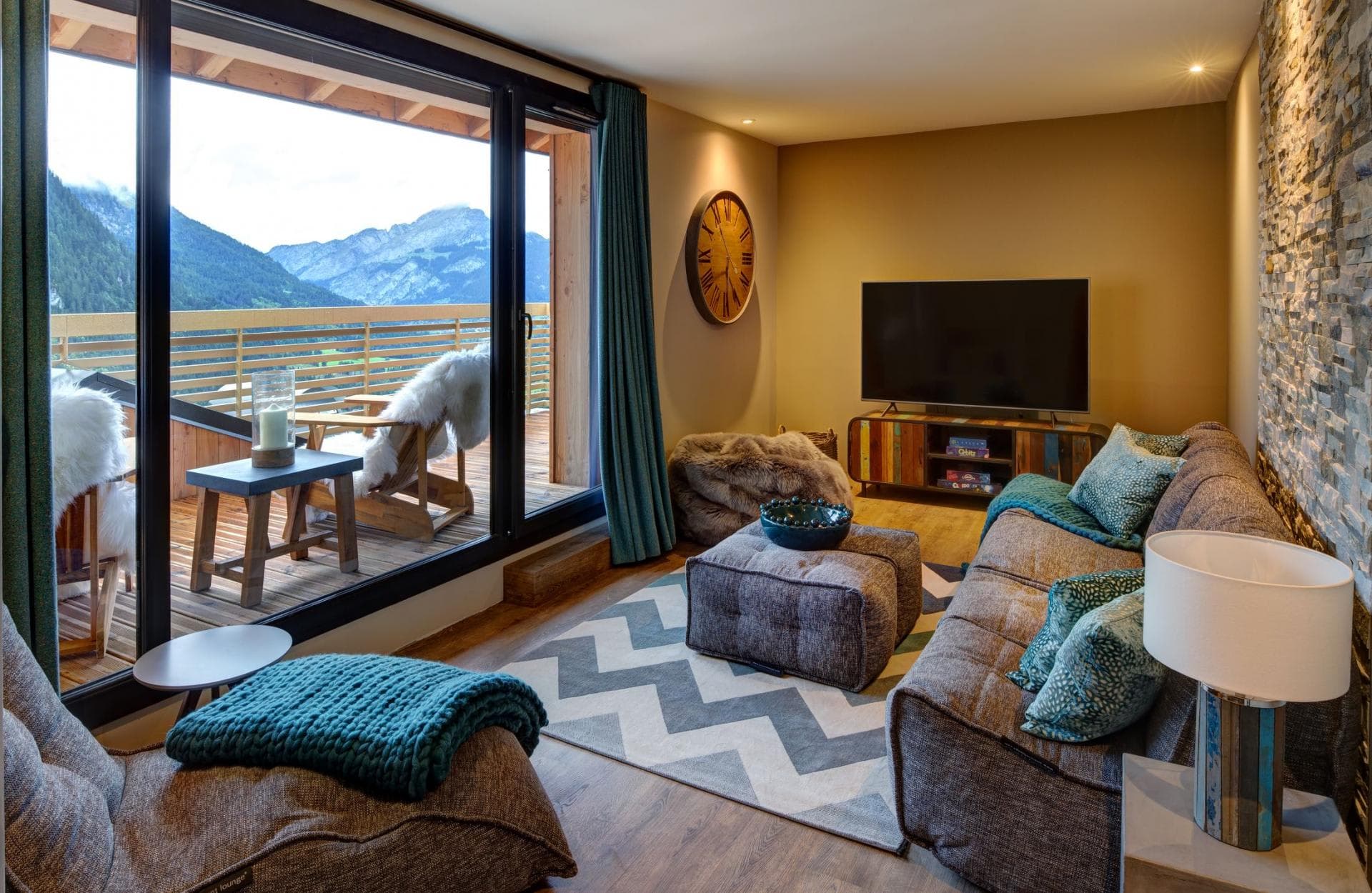 Media room with mountain views, deck access, and bean bag seating