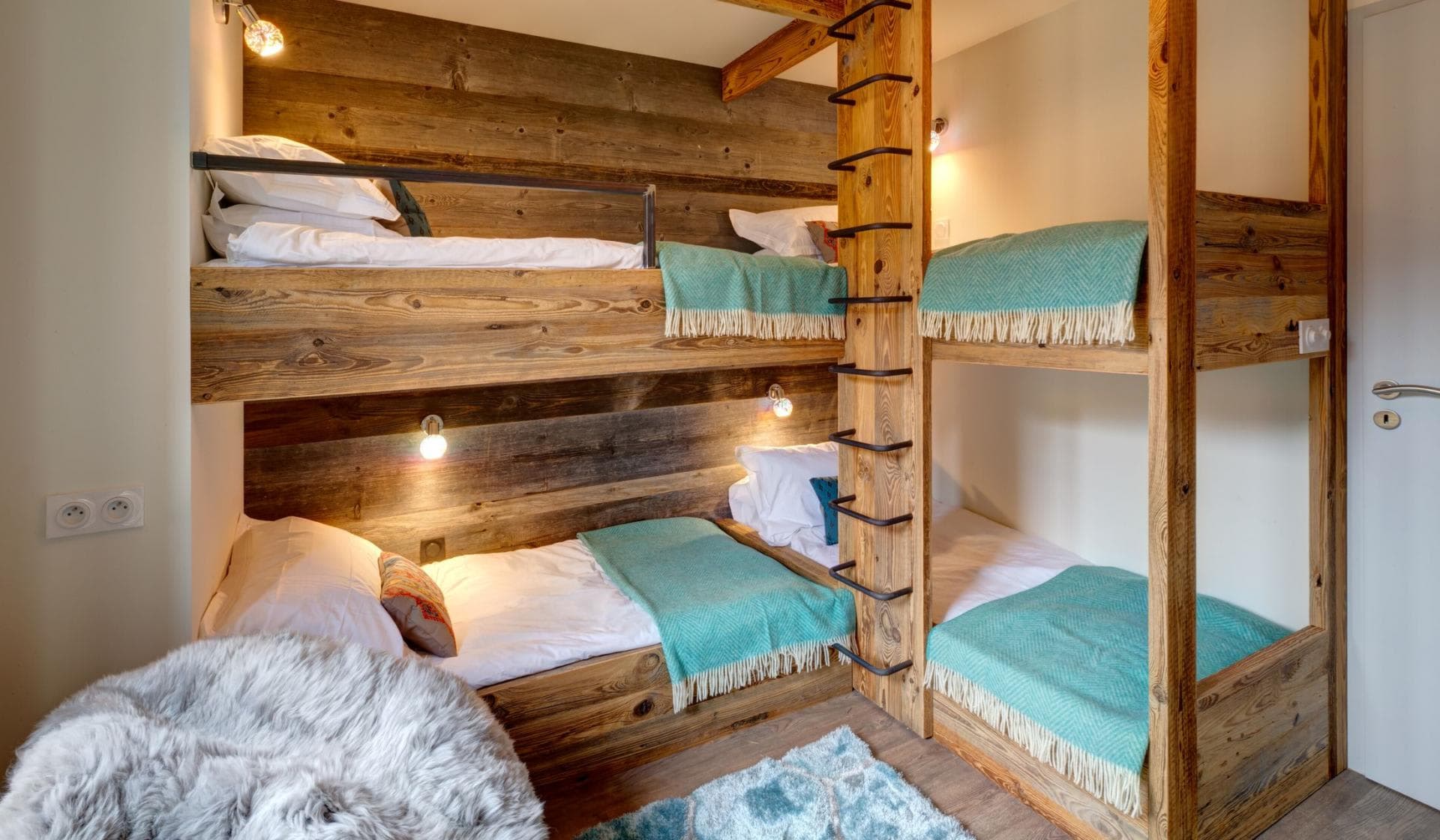 Bunk room with four twin beds and individual reading lights