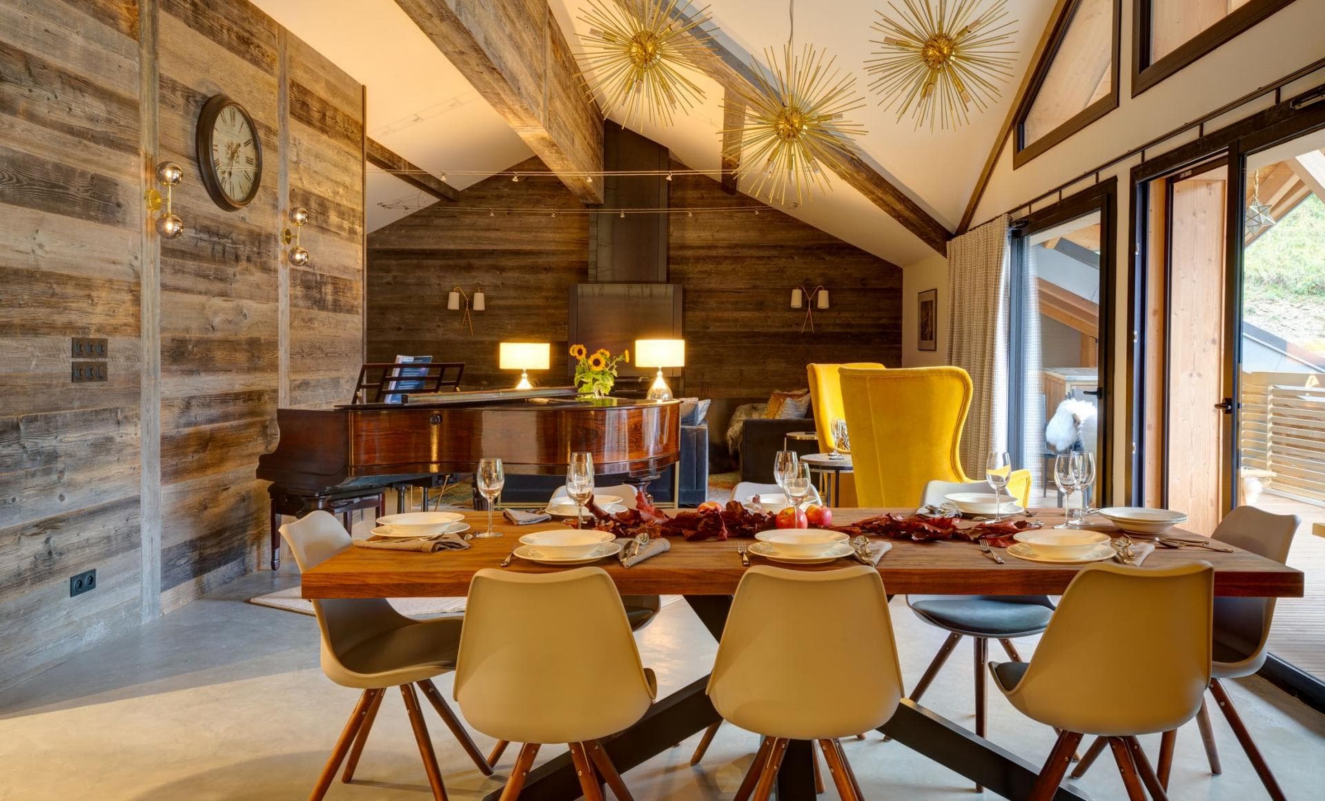 Dining area for 8 and baby grand piano with terrace access