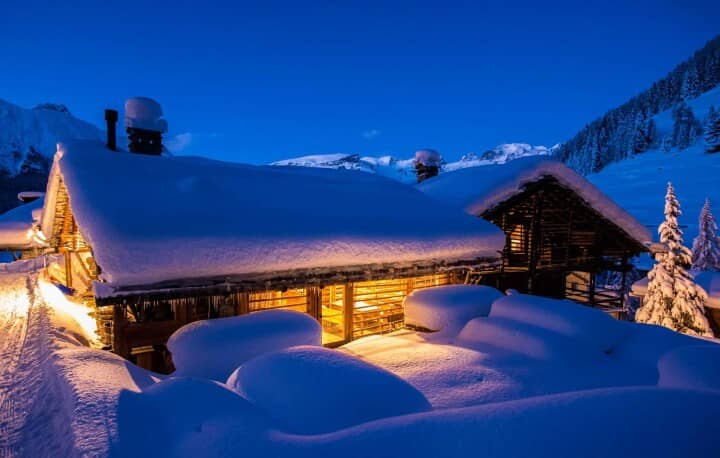 Ski-in, ski-out chalet exterior with mountain views and direct piste access