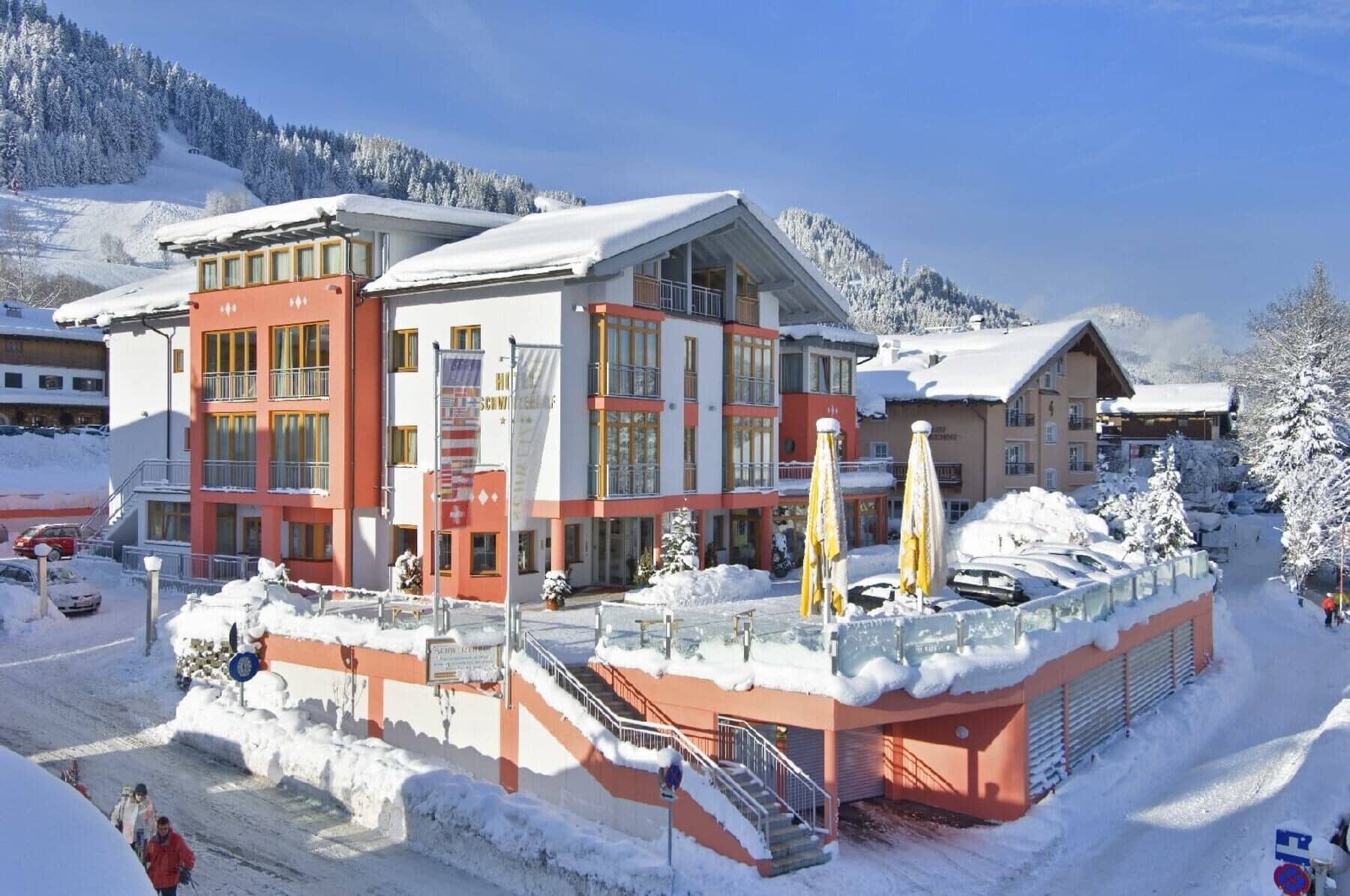 Ski-in/ski-out hotel exterior with underground parking and south-facing terrace