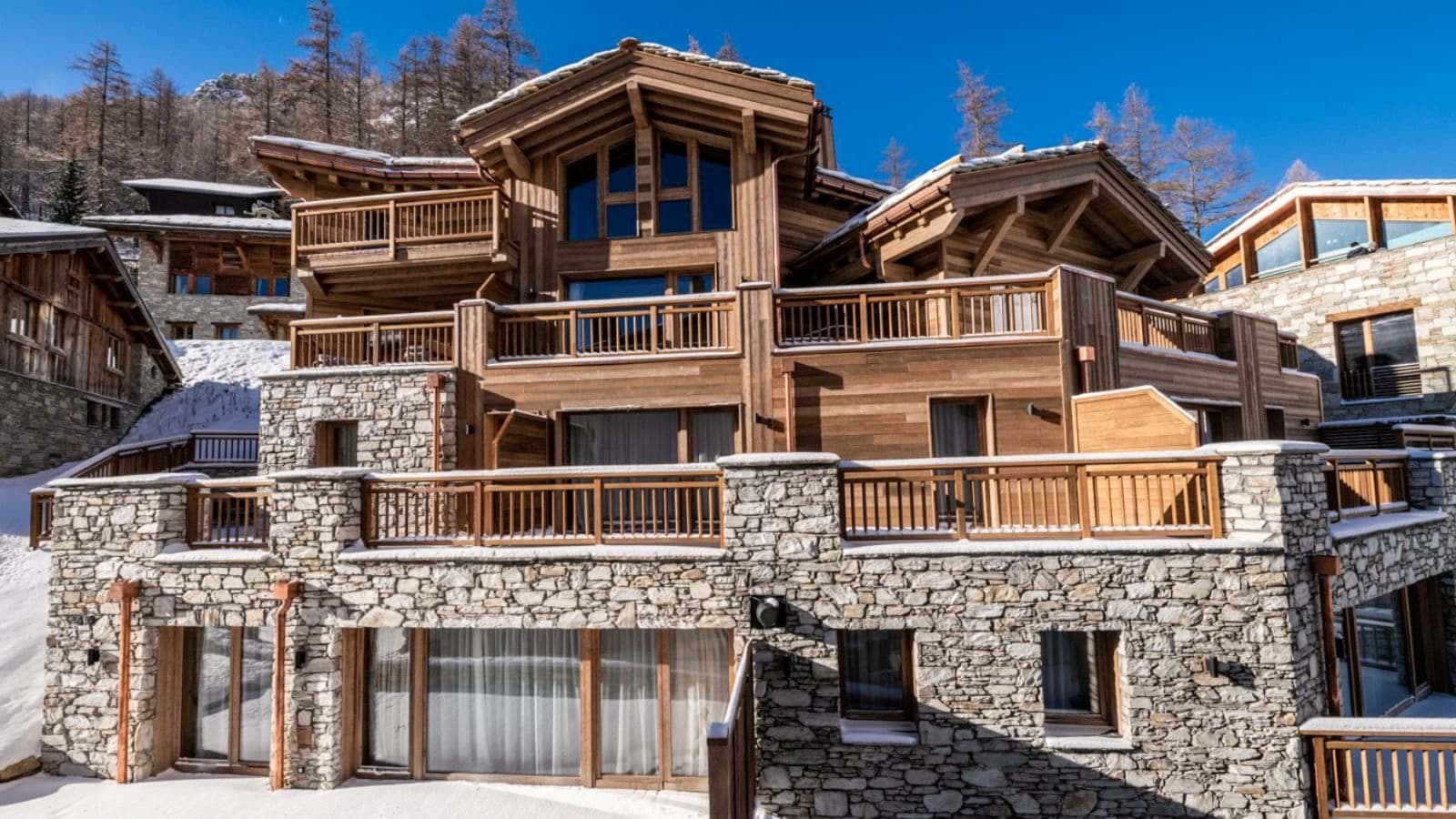 Ski-in, ski-out timber chalet with private balconies on every floor