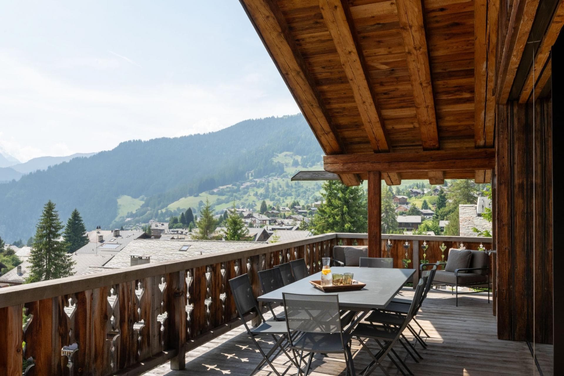Covered balcony with dining for 8 and mountain valley views