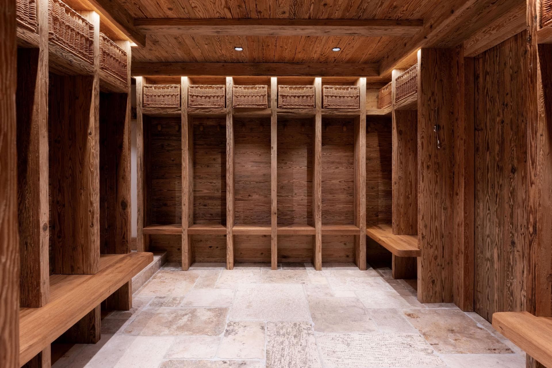 Ski room with individual gear lockers and overhead storage baskets