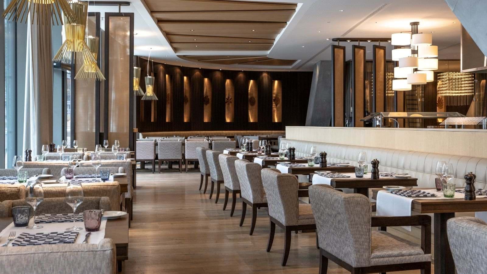 On-site restaurant with booth seating and floor-to-ceiling windows