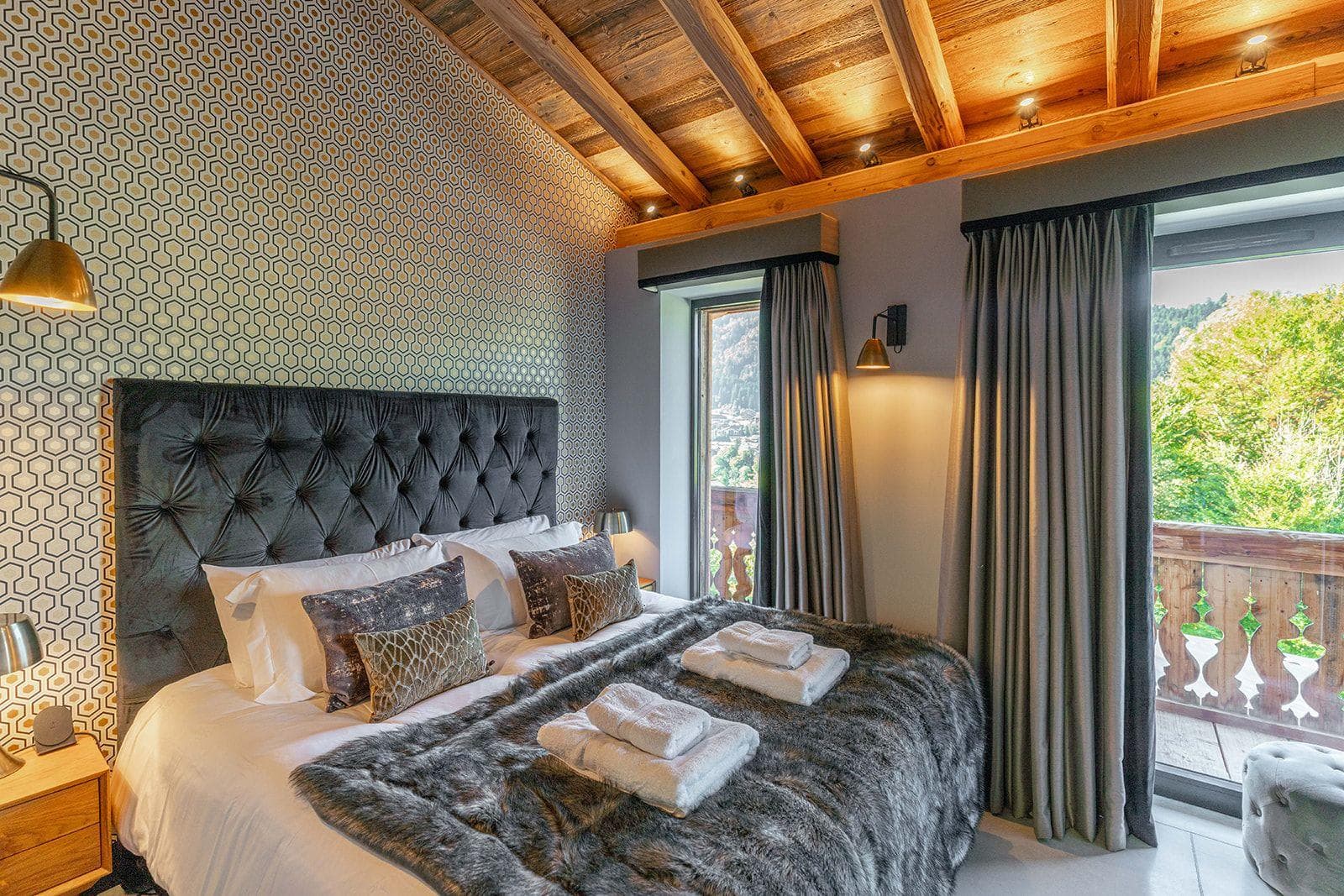 Bedroom with king bed and private balcony access