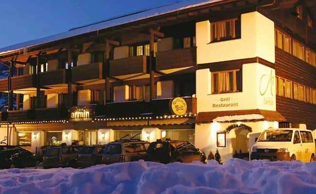 Chalet exterior featuring on-site grill restaurant and private balconies