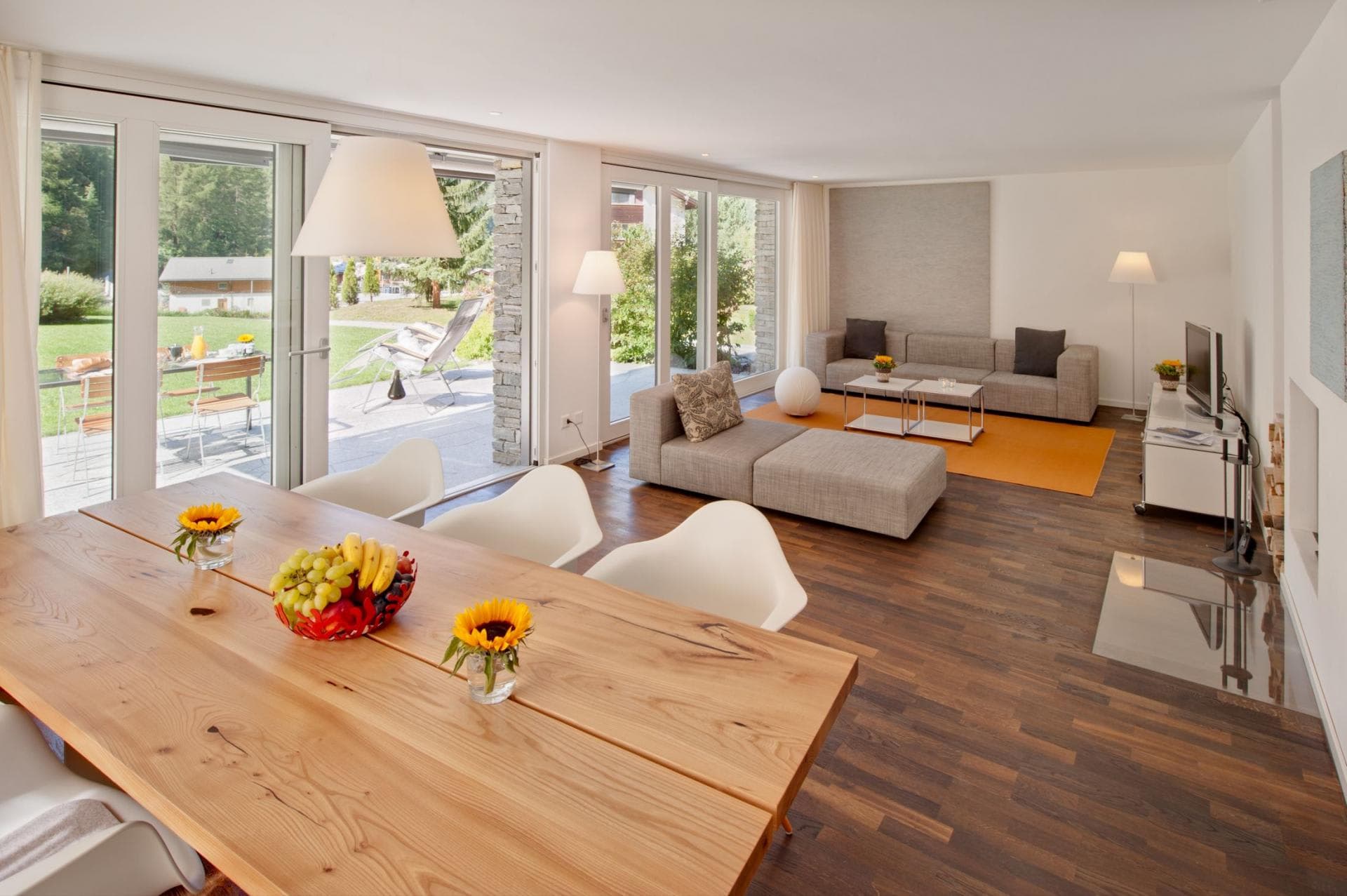 Open-plan living area with garden access and wood-burning fireplace