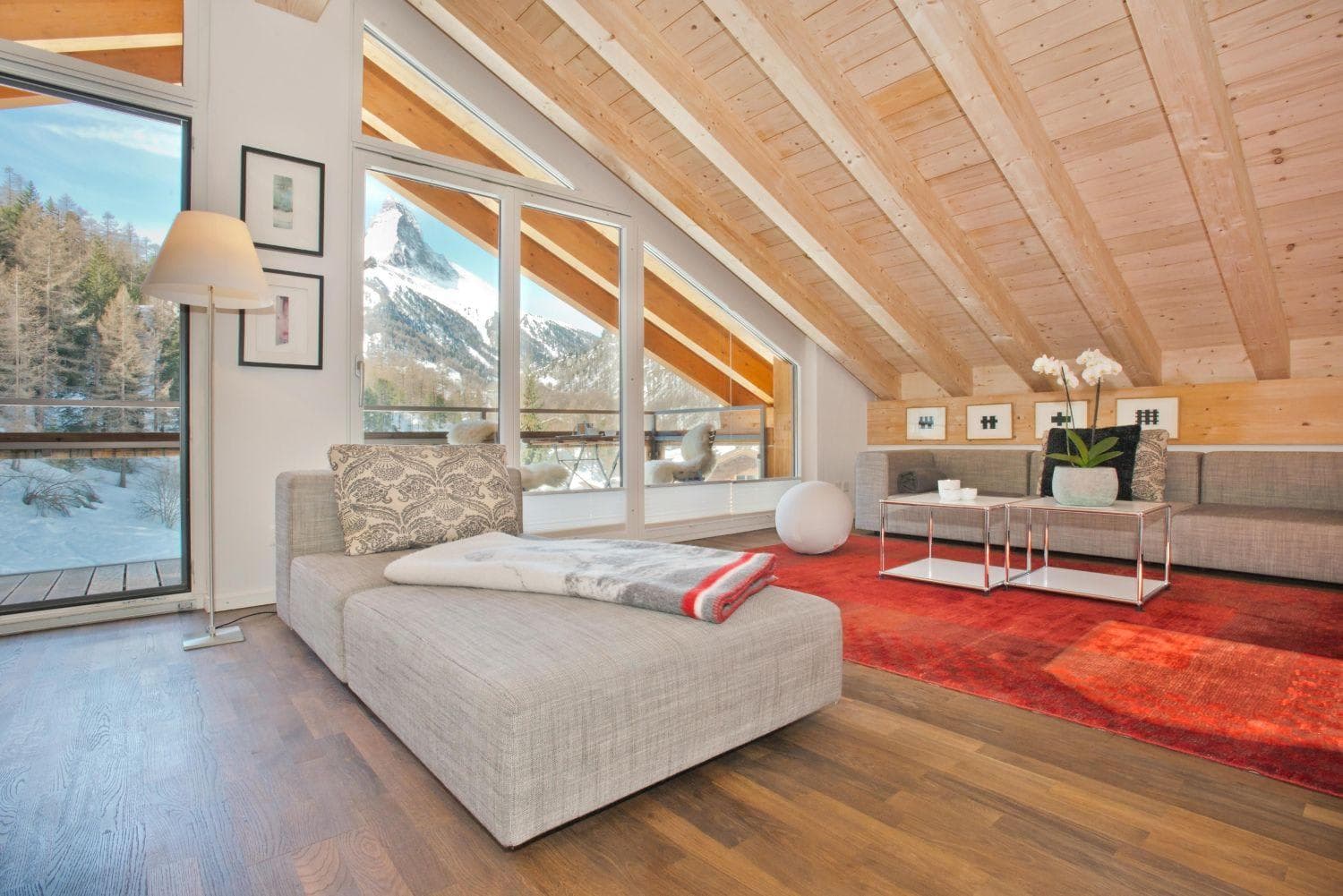 Lounge with vaulted wood ceiling and direct views of the Matterhorn