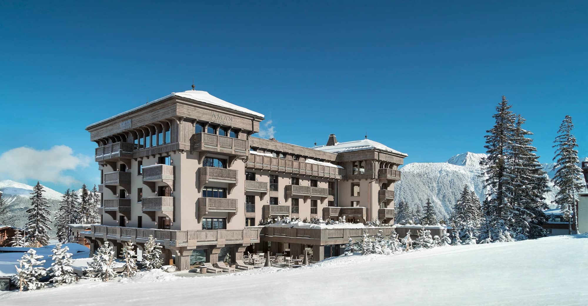 Ski-in, ski-out resort exterior with private balconies and mountain views