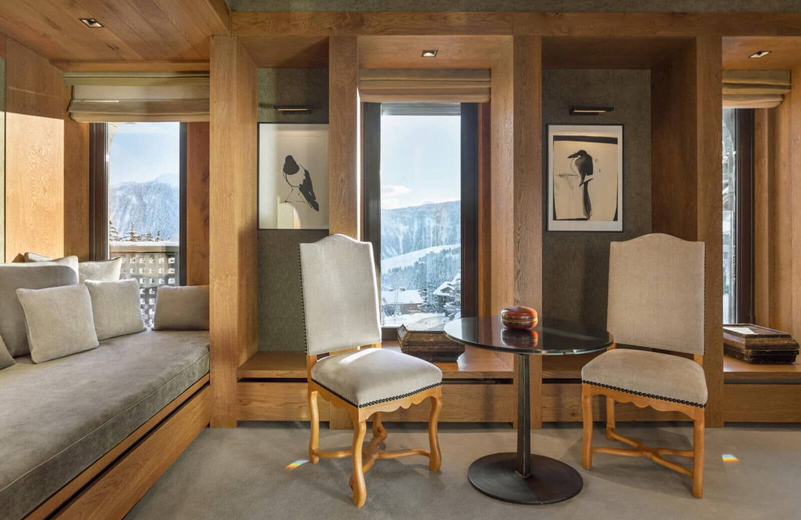 Seating area with daybed, cafe table, and mountain views