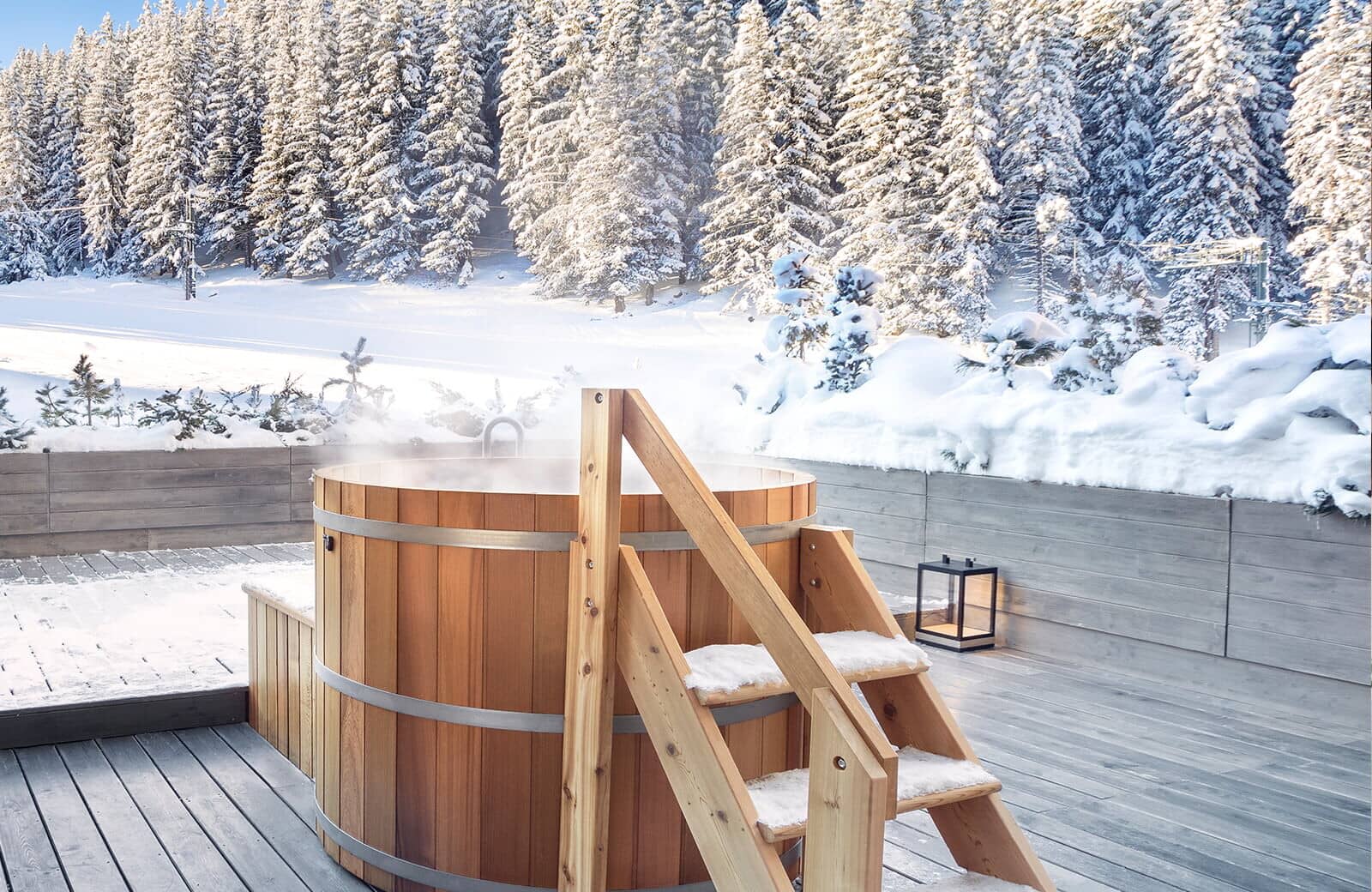 Cedar hot tub on private deck with ski-in/ski-out forest views