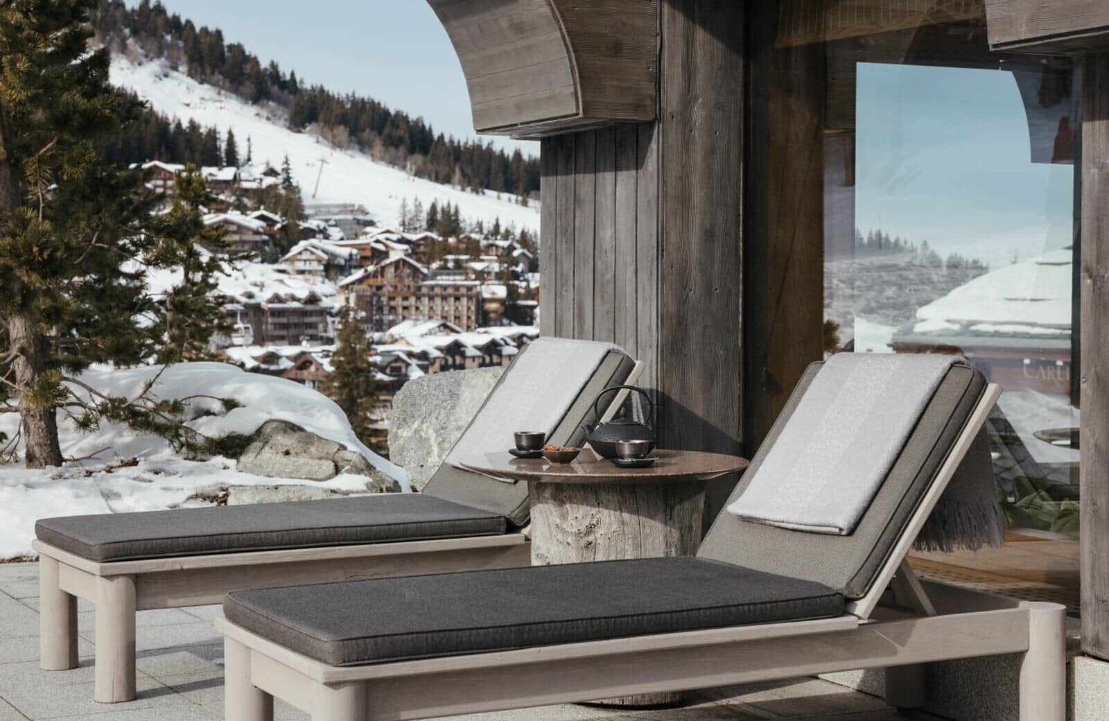 Private sun terrace with loungers and ski village views