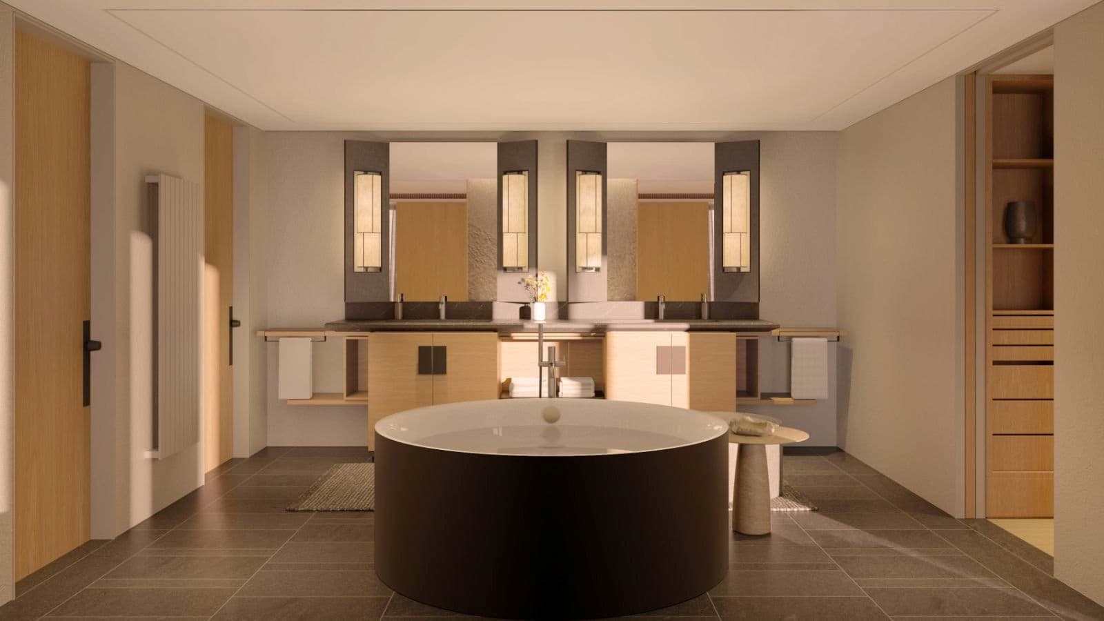 Bathroom with circular soaking tub, dual vanities, and walk-in closet