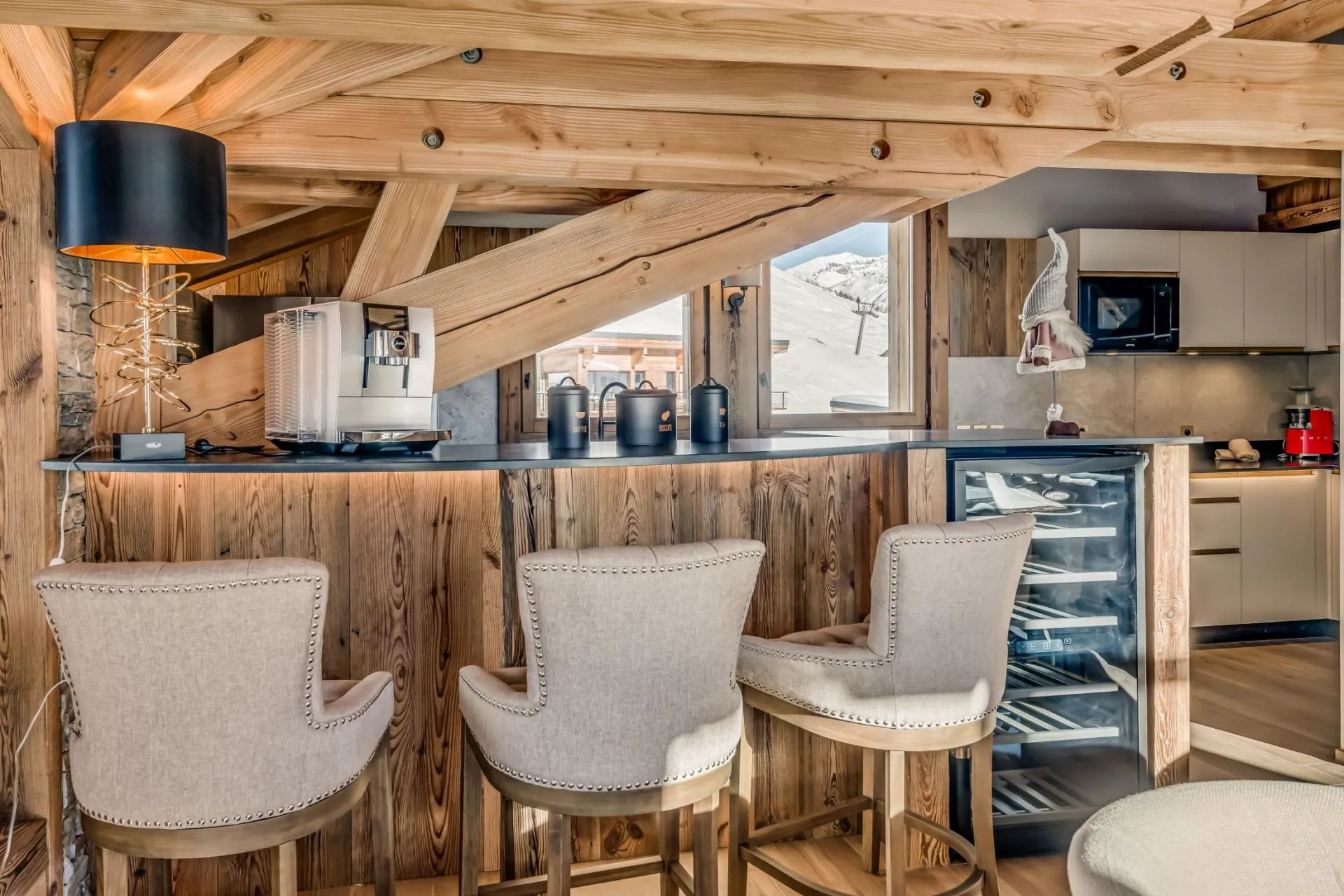 Breakfast bar with espresso machine, wine fridge, and ski slope views