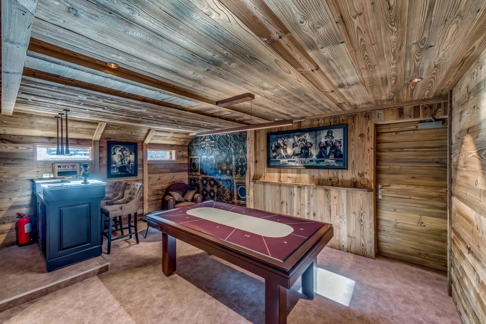Lower level games room with poker table and wet bar