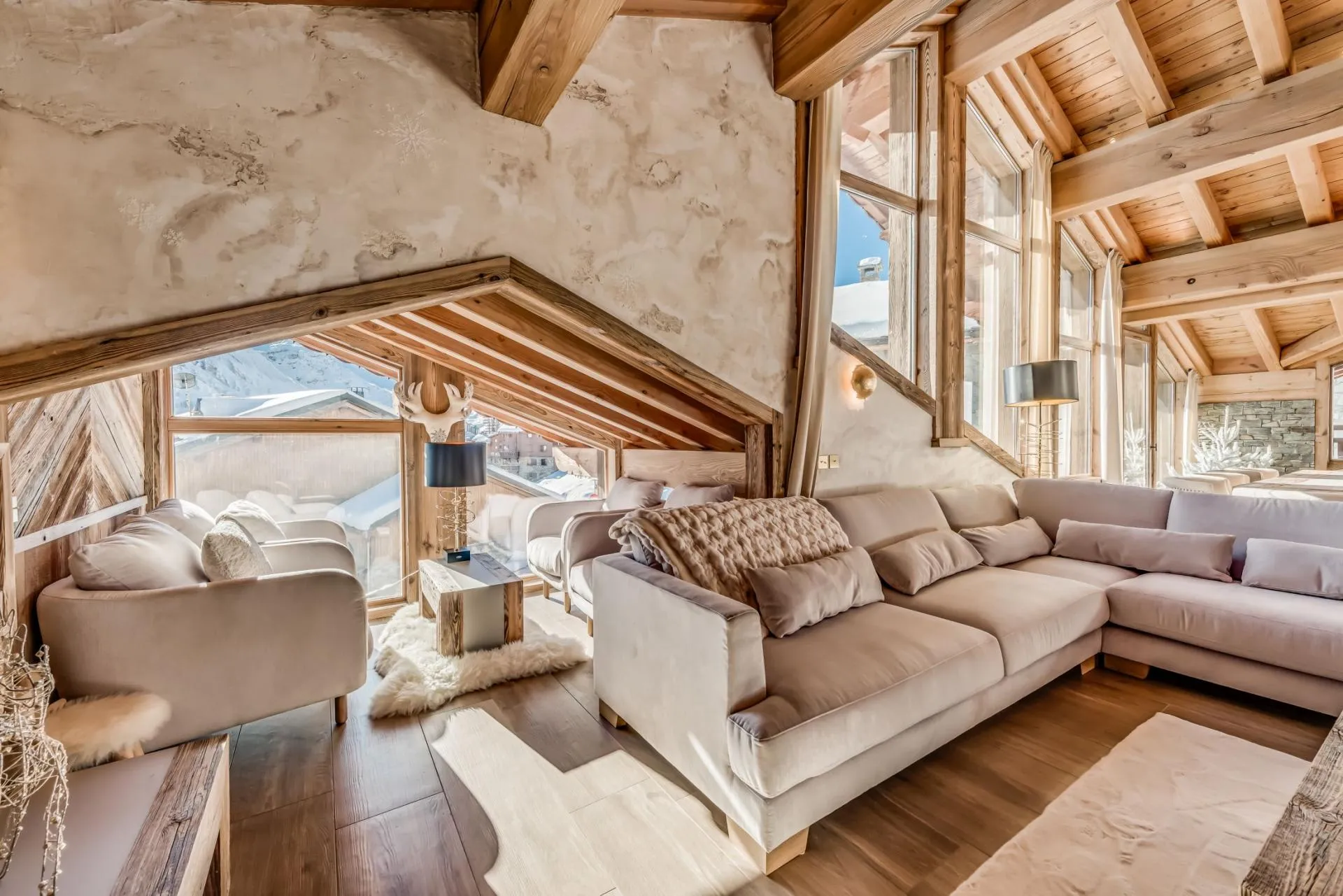 Living area with sectional seating for 10 and alpine village views