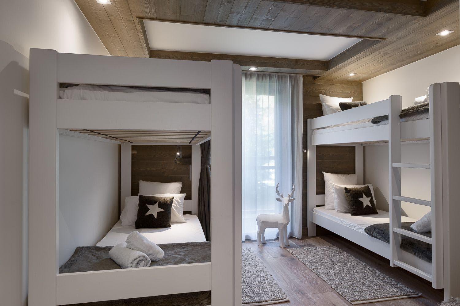 Bunk room with four twin beds and reading lights