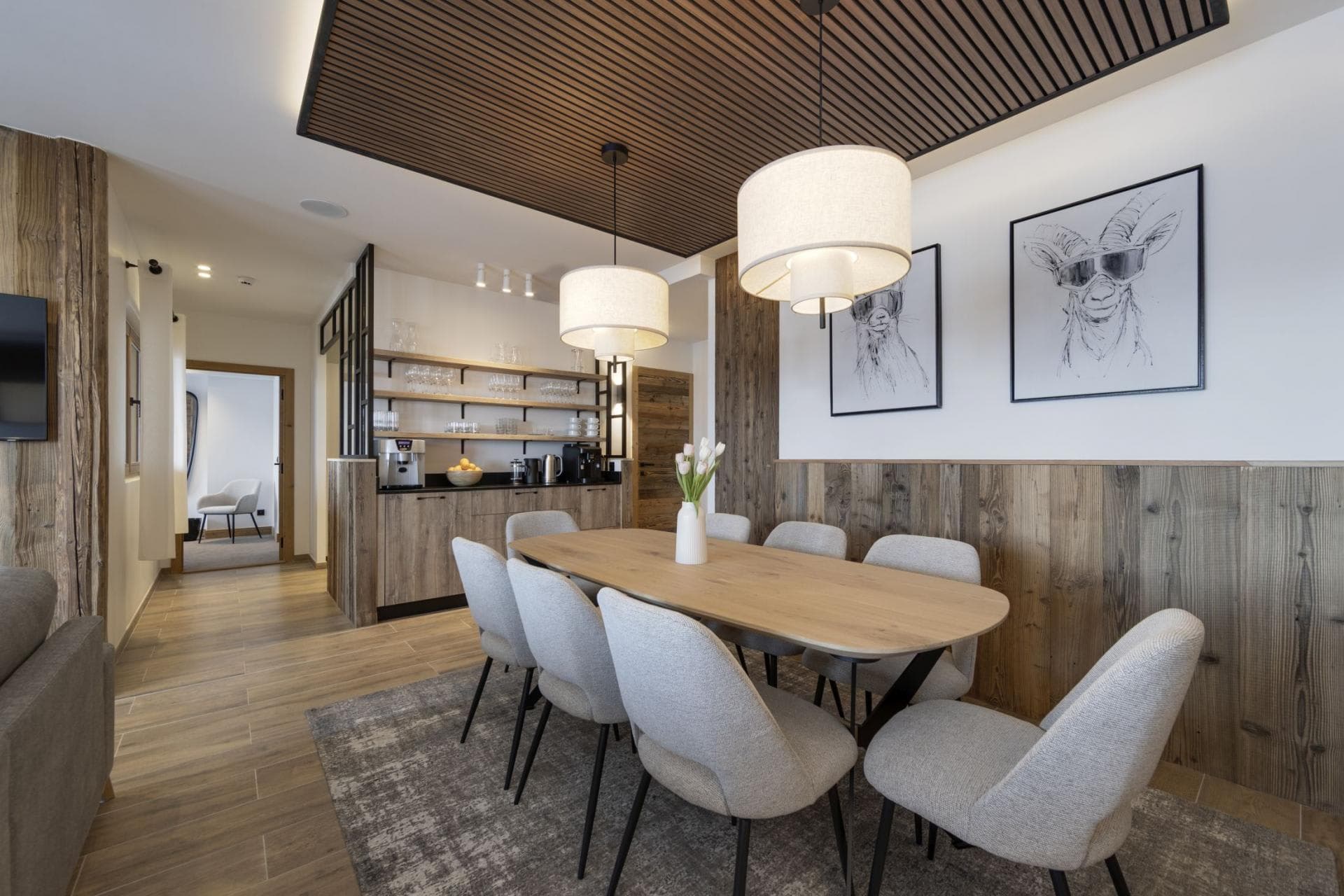 Dining area for 8 with adjacent wet bar and espresso station