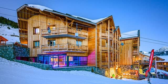 Ski-in/ski-out chalet exterior with heated indoor pool and private balconies