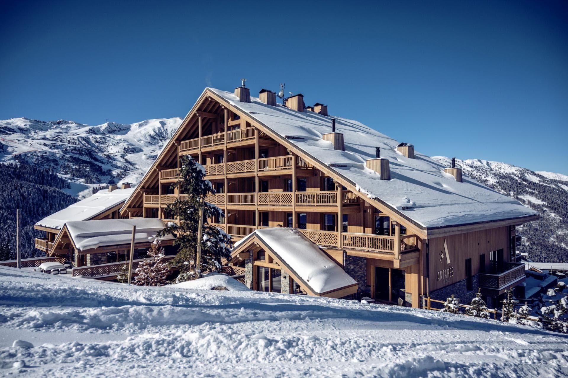 Ski-in, ski-out timber chalet with private balconies and mountain views