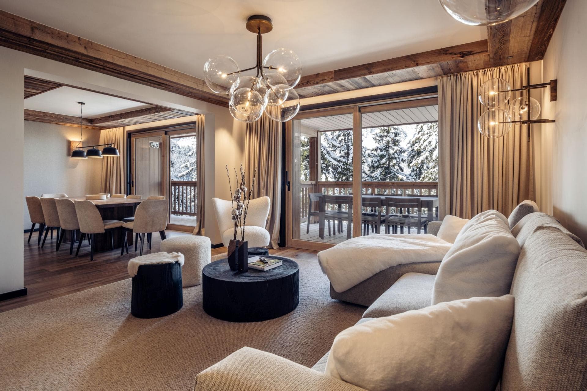 Open living area with deck access and dining seating for 10