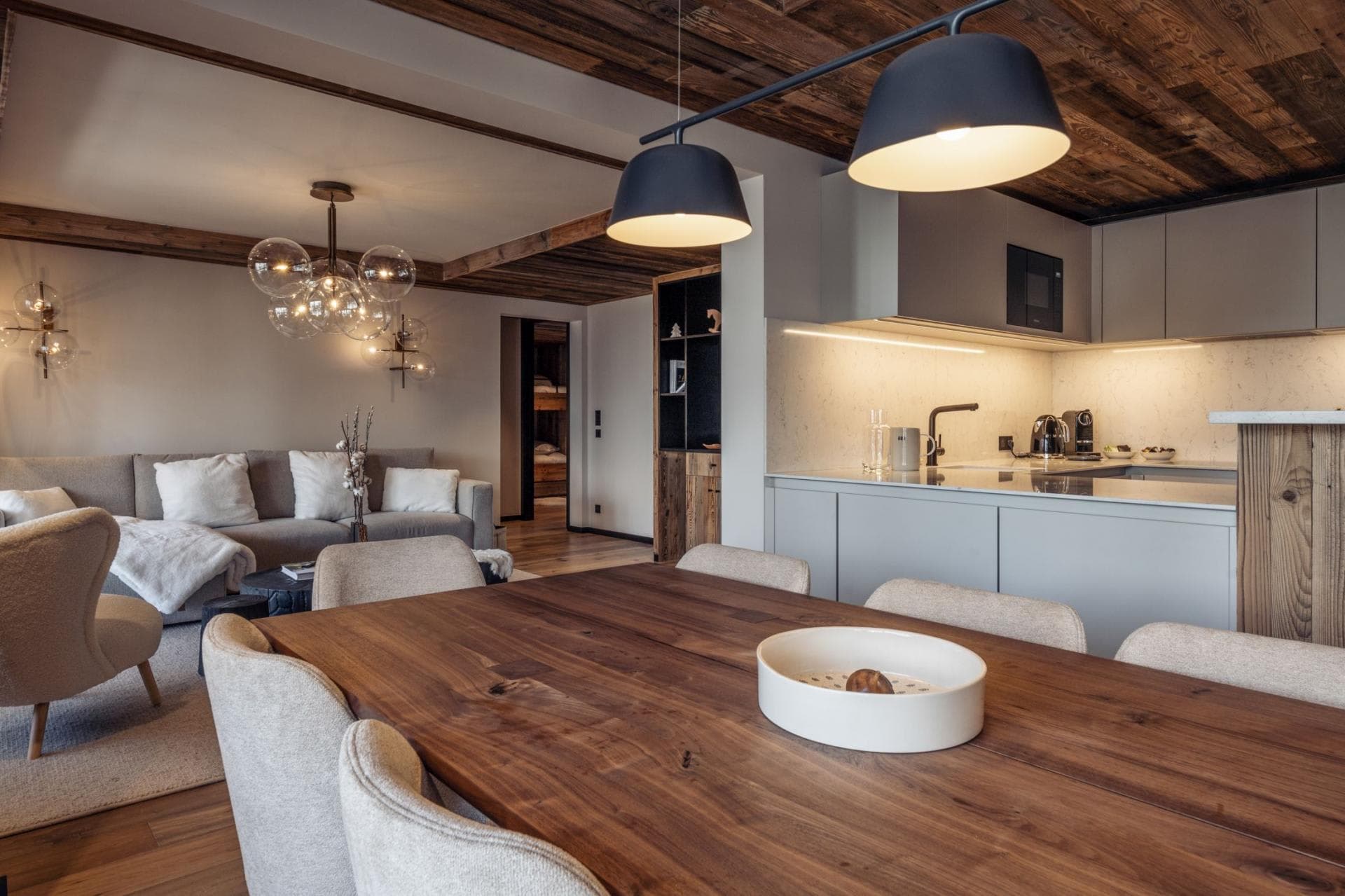 Open-concept living area with dining for 6 and reclaimed wood ceilings