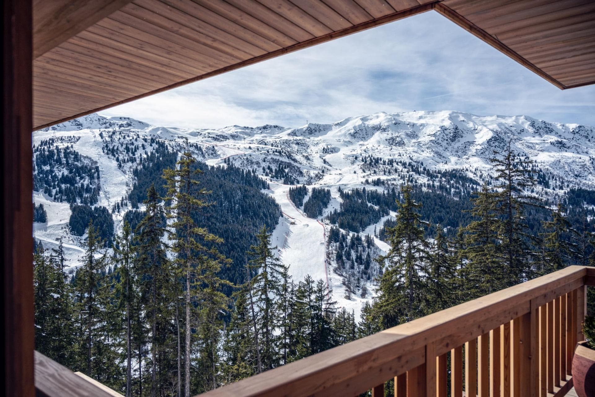 Covered balcony with direct views of groomed ski runs and mountains