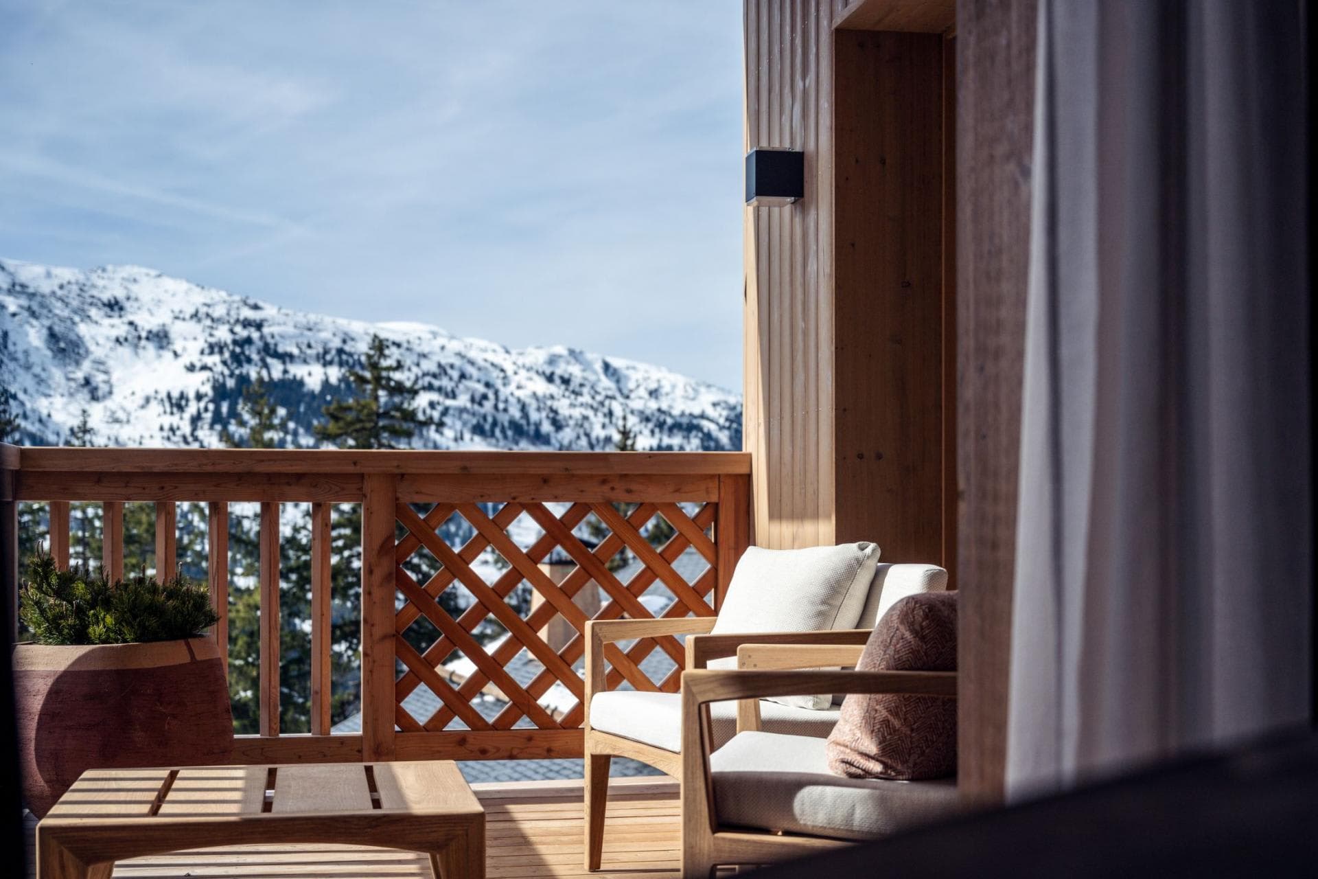 Balcony with seating for two and mountain views