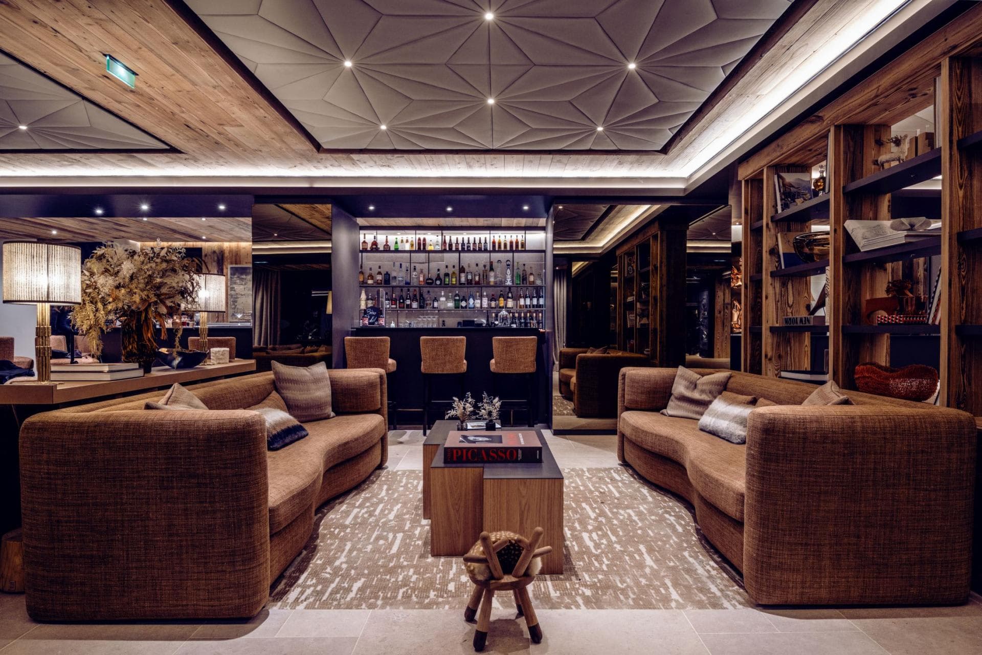 Private bar and lounge with full spirit selection and upholstered seating