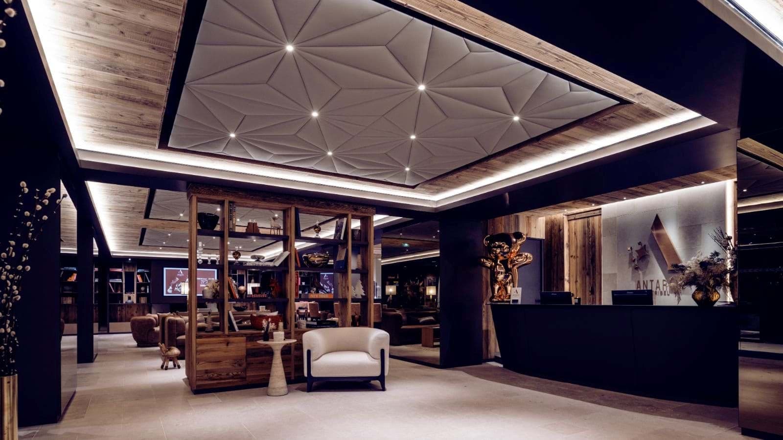 Reception lobby with library lounge and recessed geometric ceiling