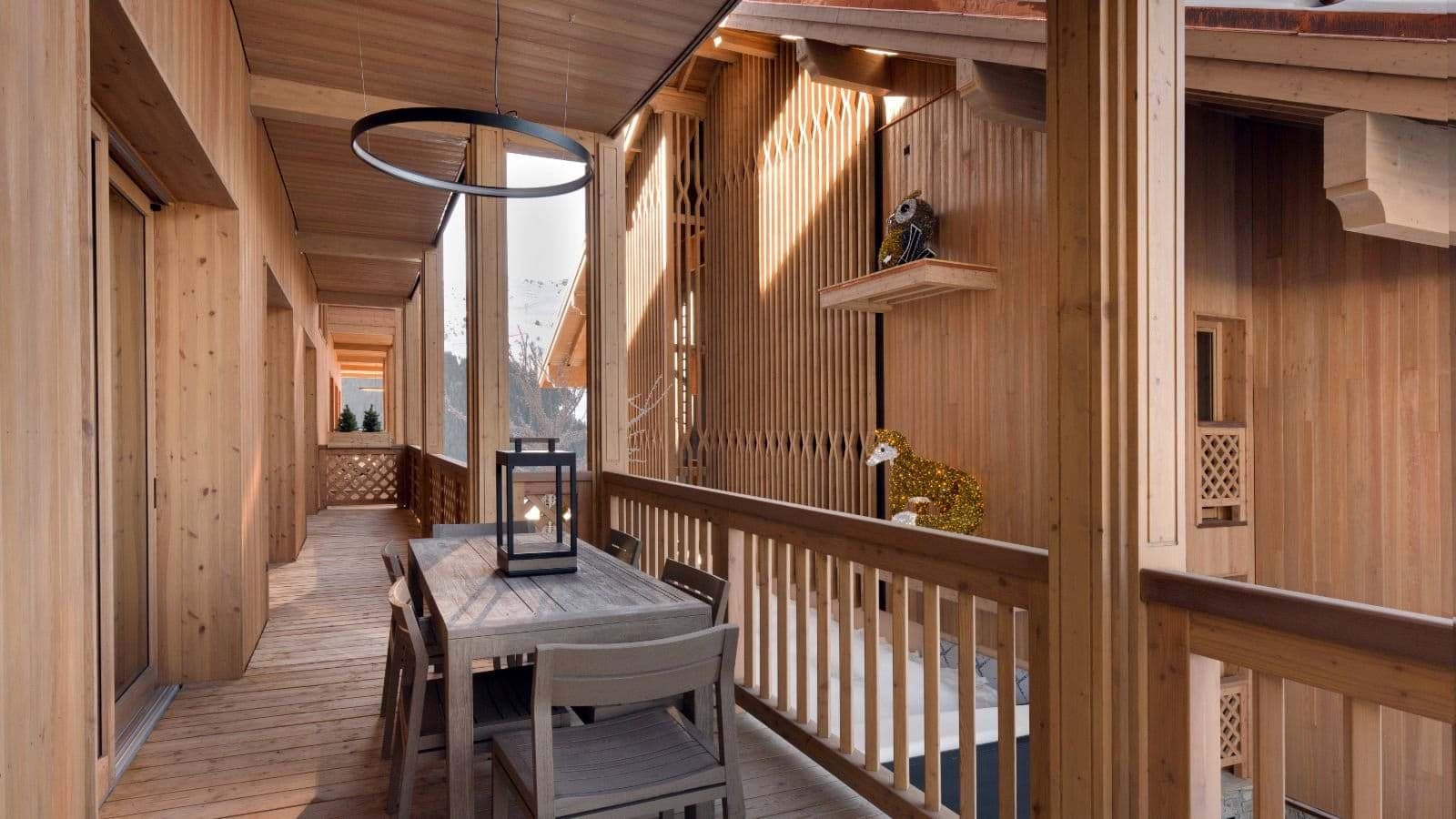 Covered balcony with dining table for 4 and mountain views