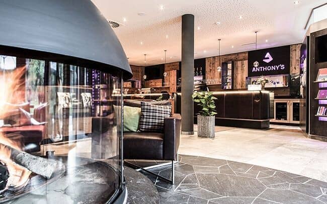 Lobby lounge with 360-degree glass fireplace and leather seating