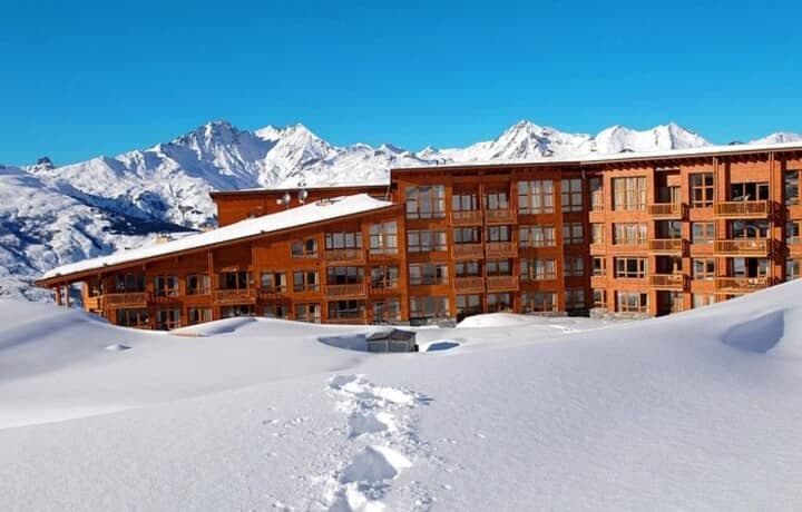 Ski-in/ski-out lodge with private balconies and mountain peak views