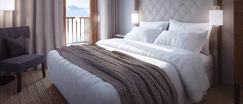 Primary bedroom with king bed and private balcony access