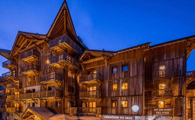 Ski-in/ski-out chalet exterior with on-site equipment rental shop