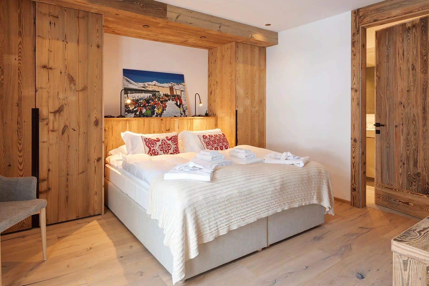 Guest bedroom with king bed and reclaimed wood built-in wardrobes