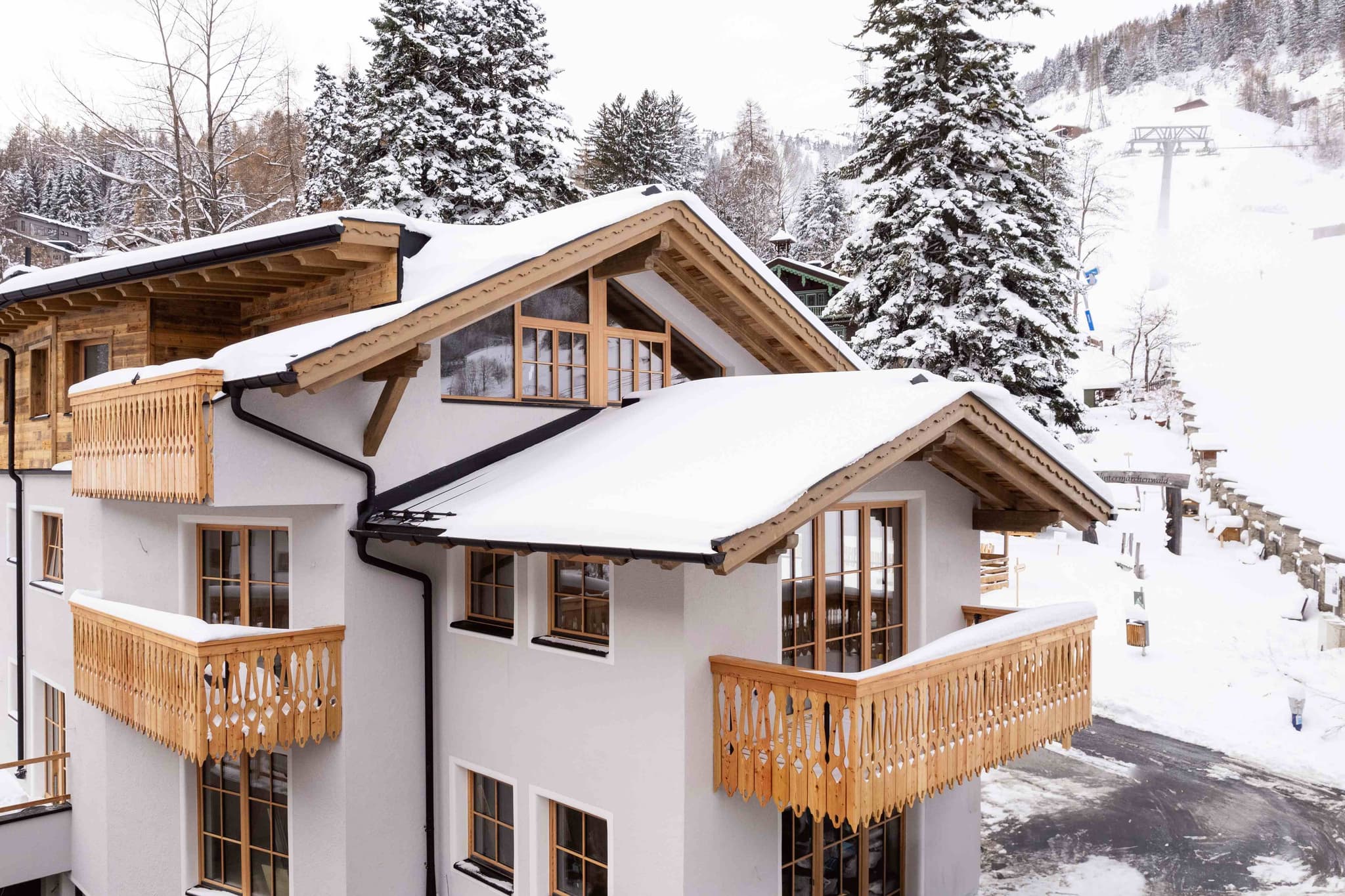 Chalet exterior with multiple private balconies and direct ski-in access
