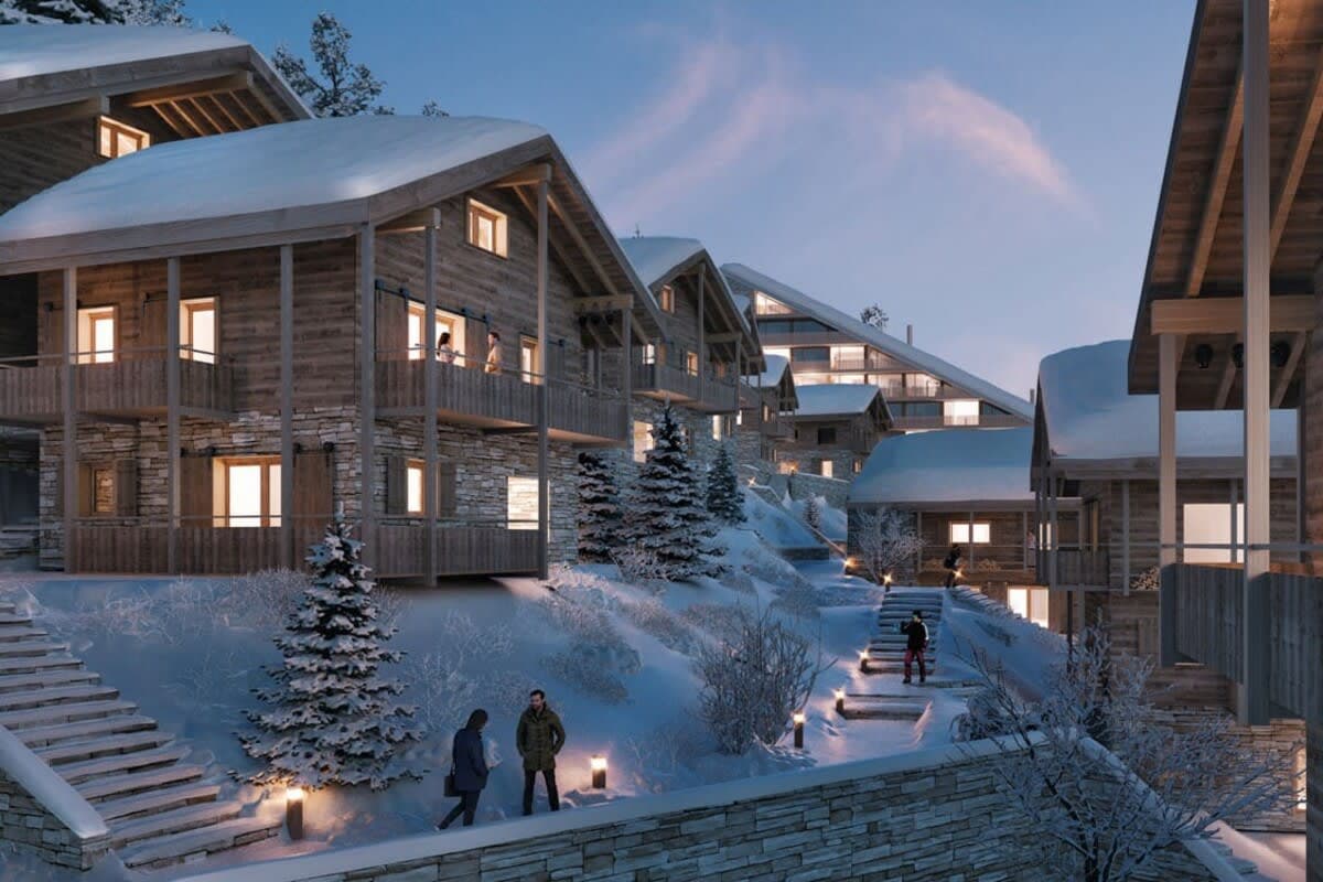 Ski-in/ski-out chalets with private balconies and illuminated stone walkways