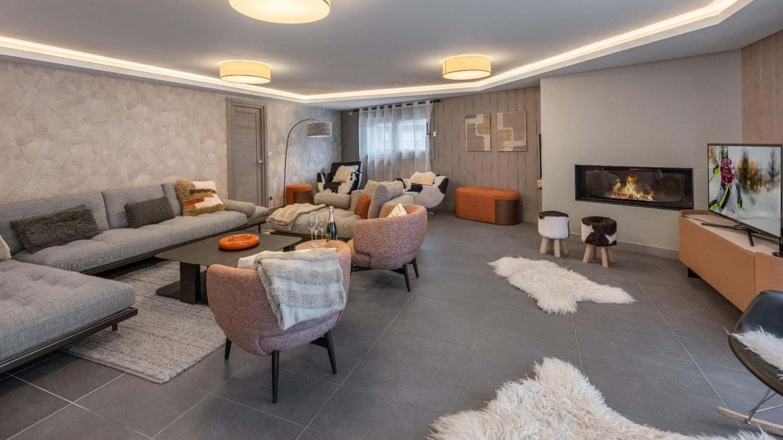 Living area with a wood-burning fireplace and lounge seating