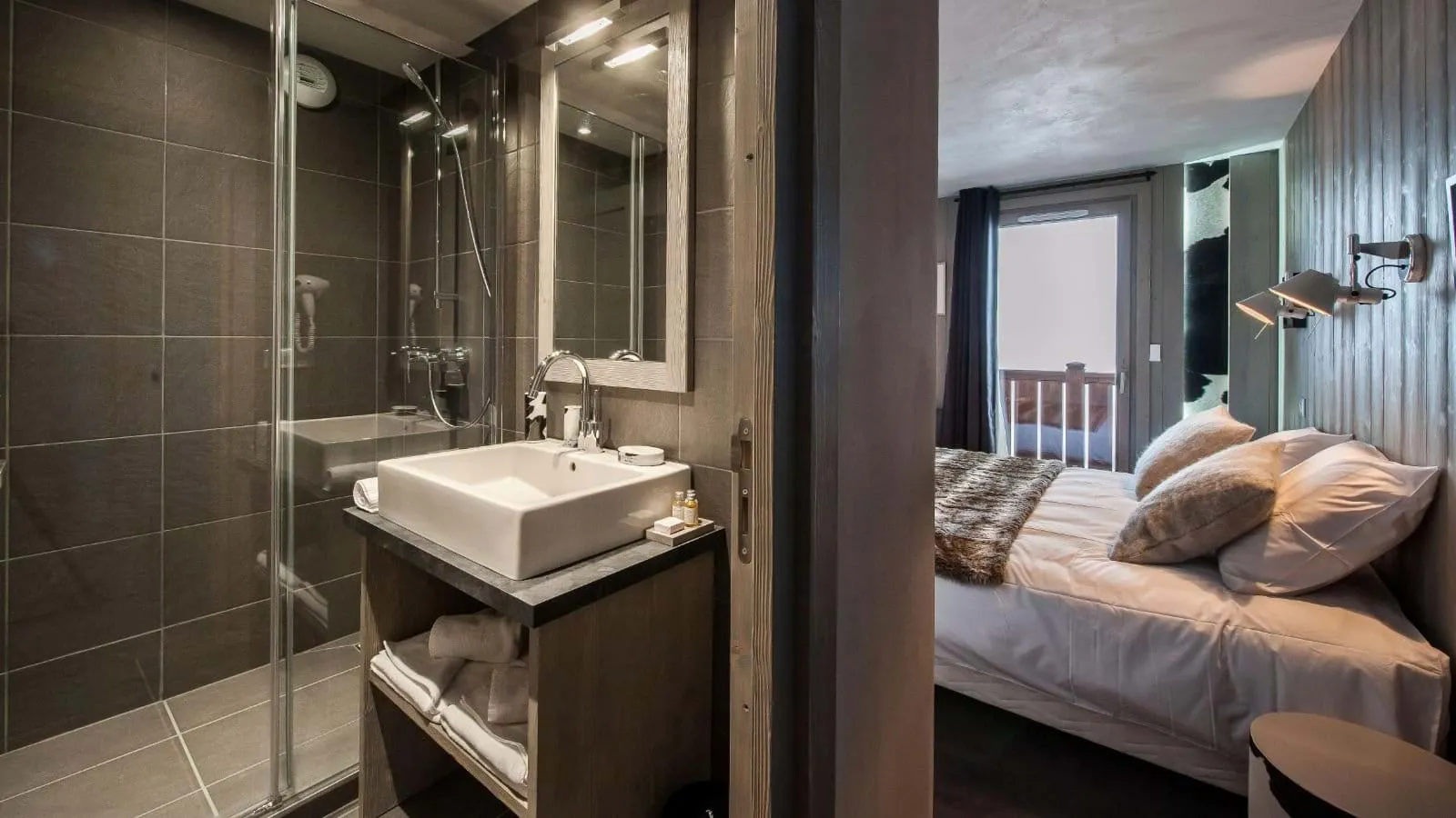 En-suite shower room with a walk-in shower and stone basin