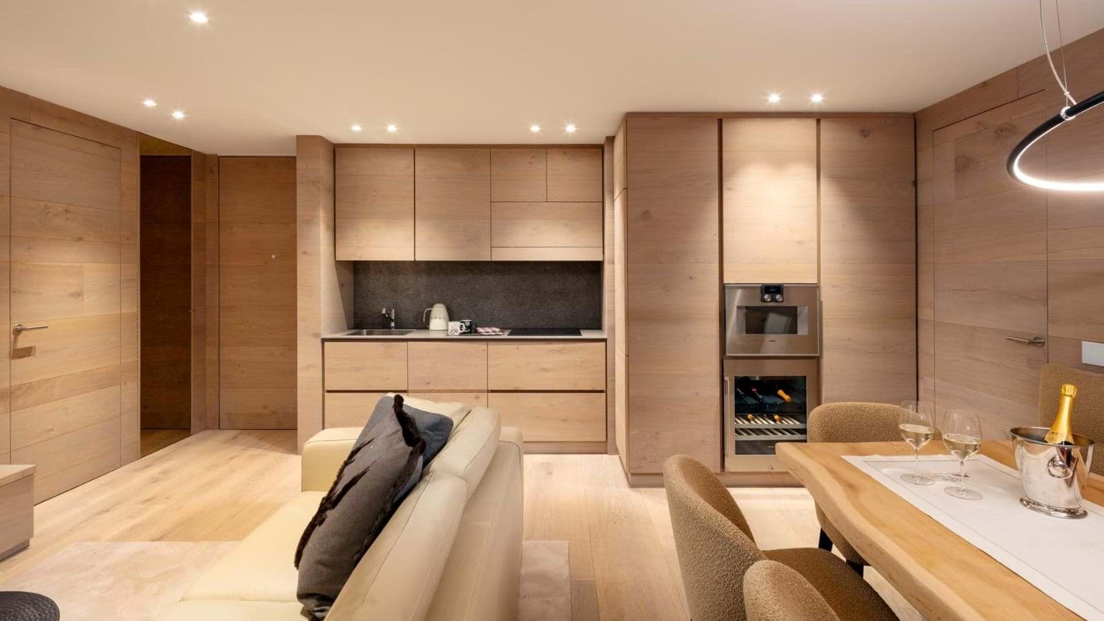 Kitchenette with induction cooktop, wall oven, and integrated wine fridge