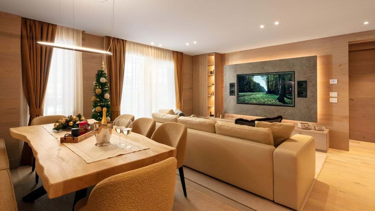 Open living area with live-edge dining table and integrated surround sound system