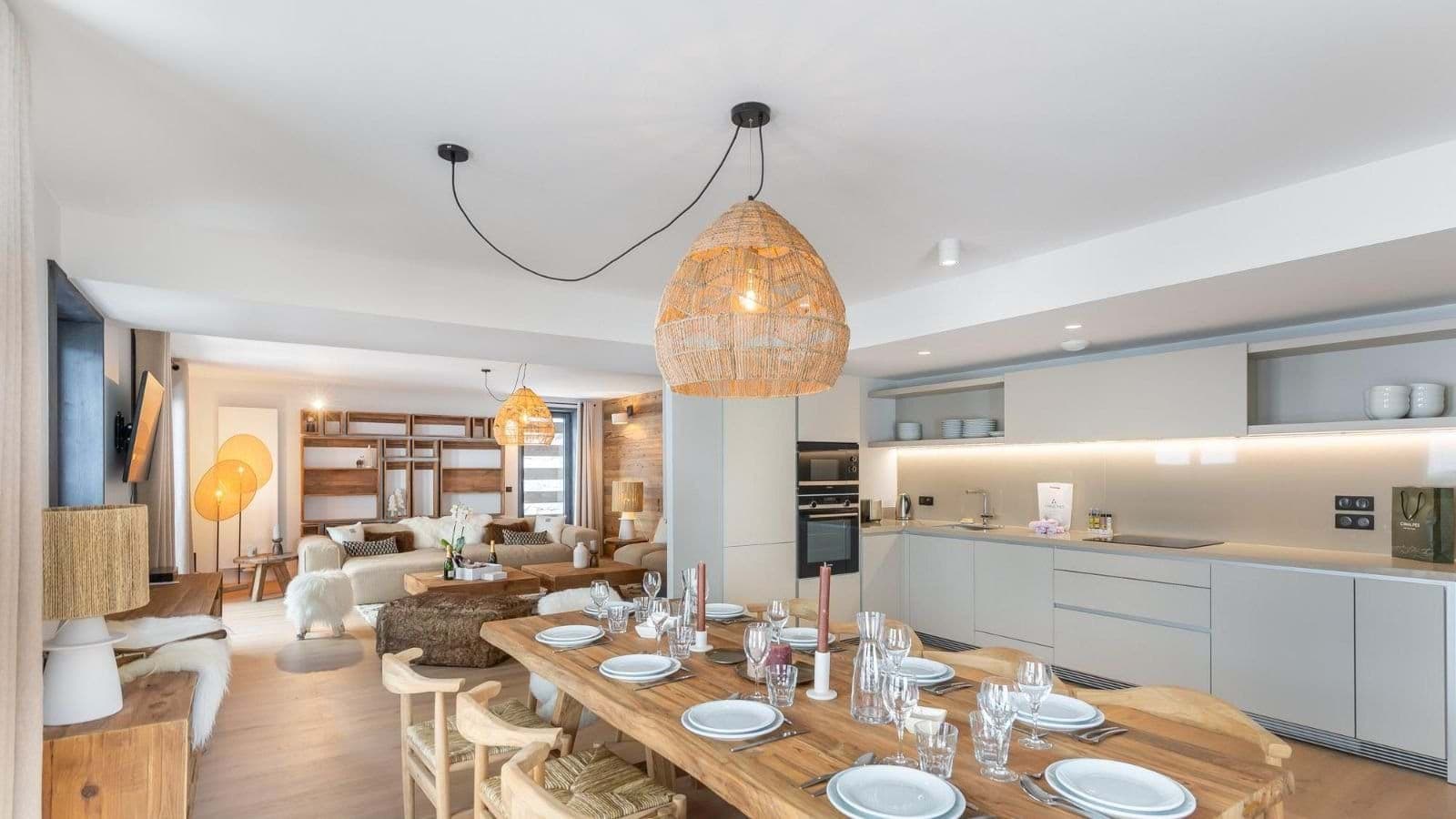Open-plan living area with dining table for 8 and integrated kitchen