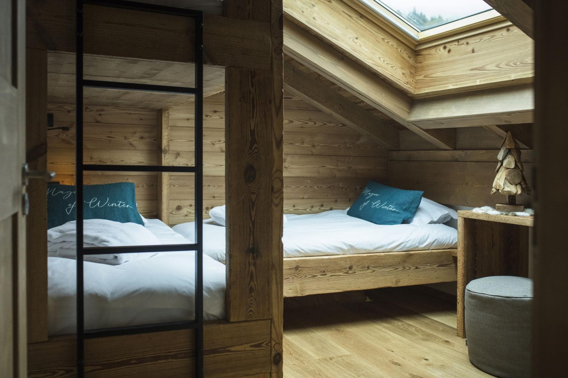 Bunk room with two twin beds and skylight window