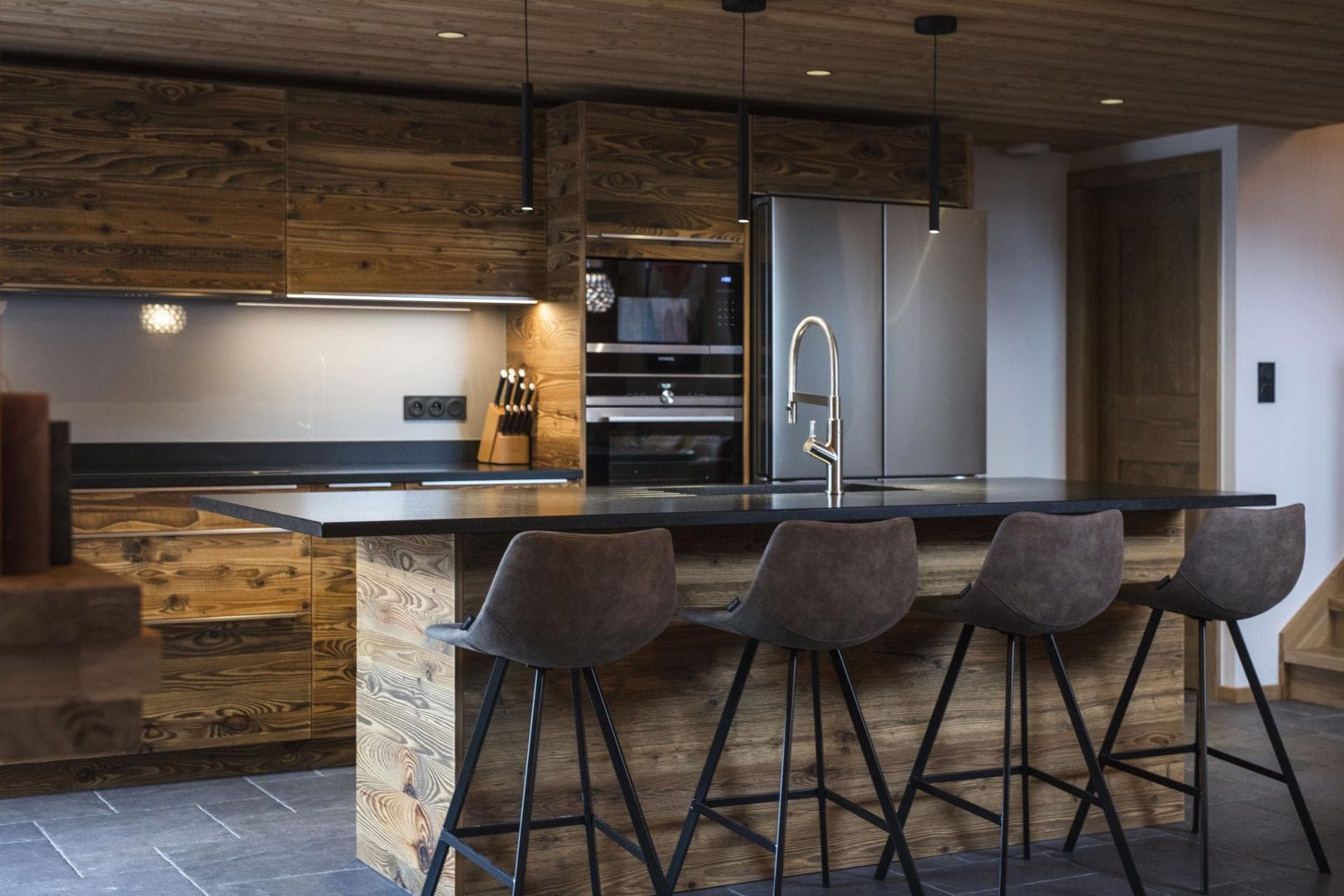 Kitchen island with seating for 4, induction cooktop, and double wall oven