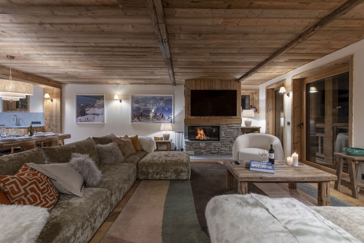 Living area with wood-burning fireplace and sectional seating for 8