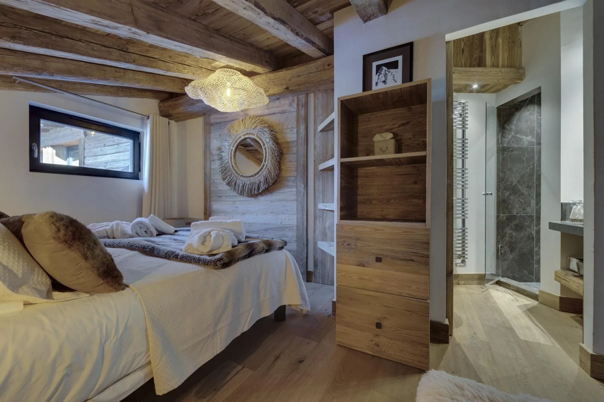 Guest bedroom with timber-beamed ceiling and ensuite walk-in shower