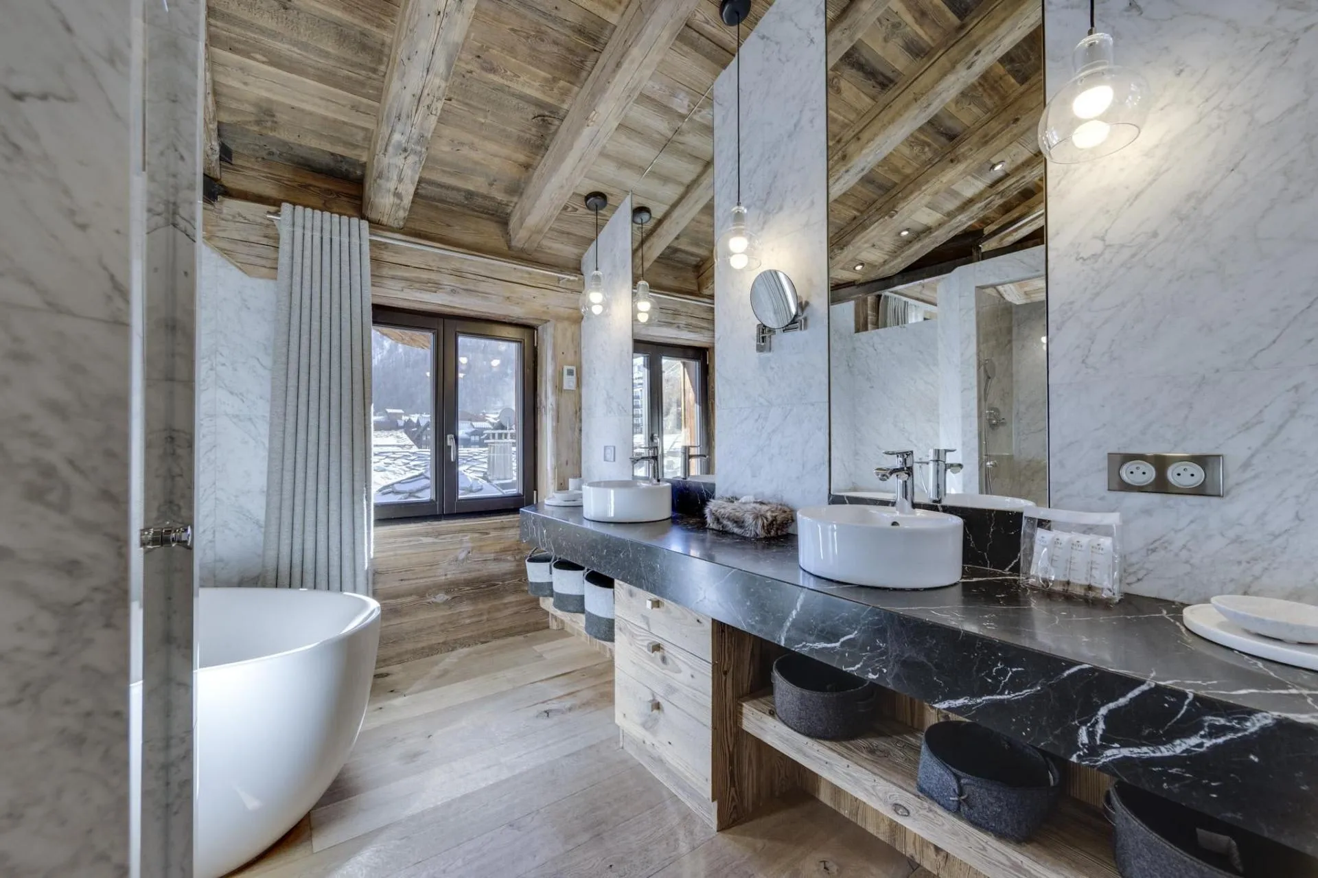 Bathroom with dual vanity, vessel sinks, and freestanding soaking tub