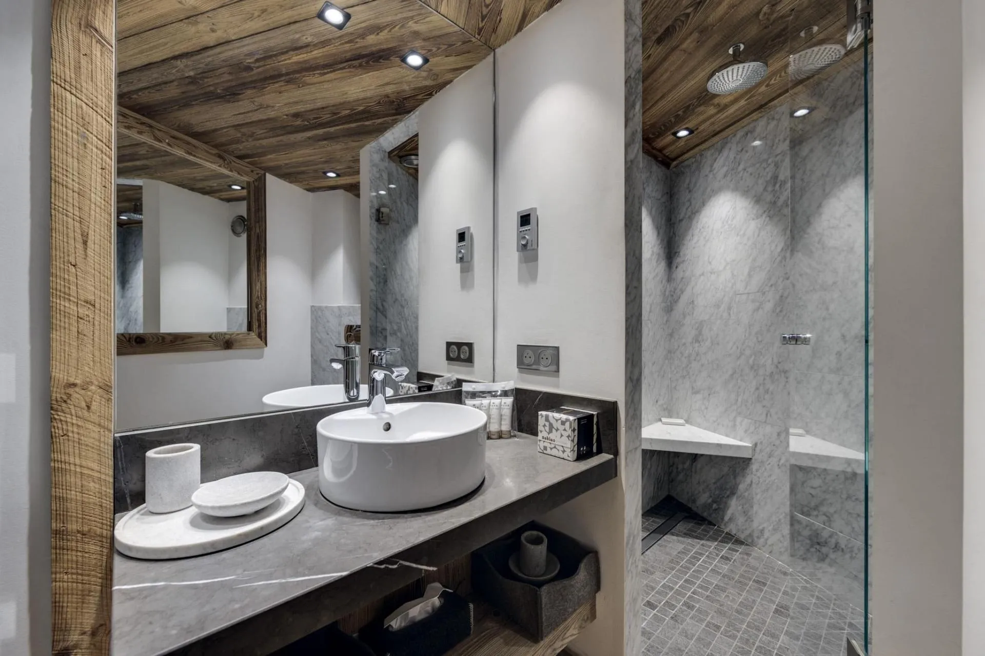 Bathroom with marble walk-in shower and rainfall showerheads